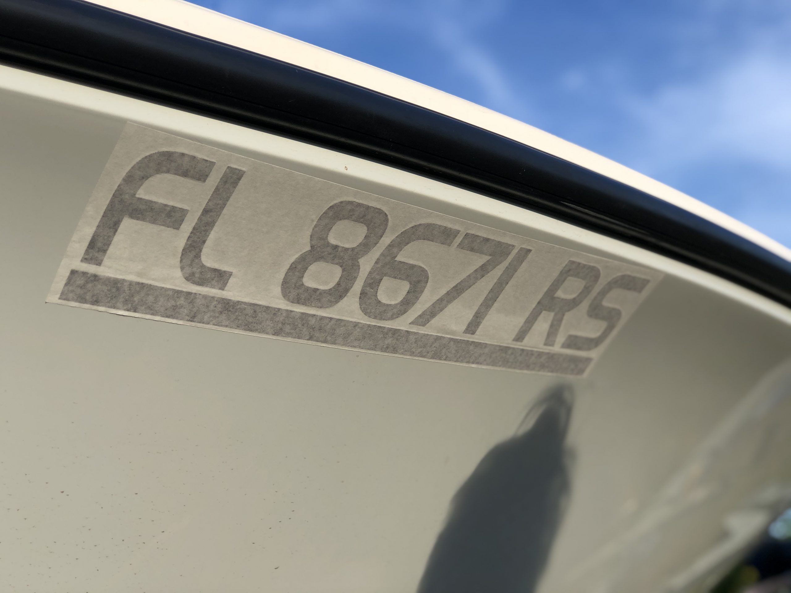 MarineReg affixed vessel registration numbers on bow of boat